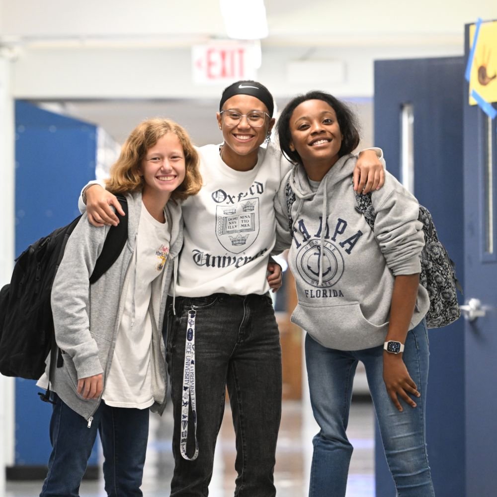 3 St. Martin's students in the hallway